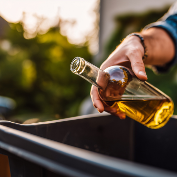 drink glass being thrown in the bin