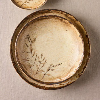 Two rustic ceramic bowls stacked