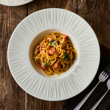 Plate of spaghetti with herbs